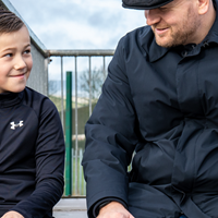 Adult and child talking outside